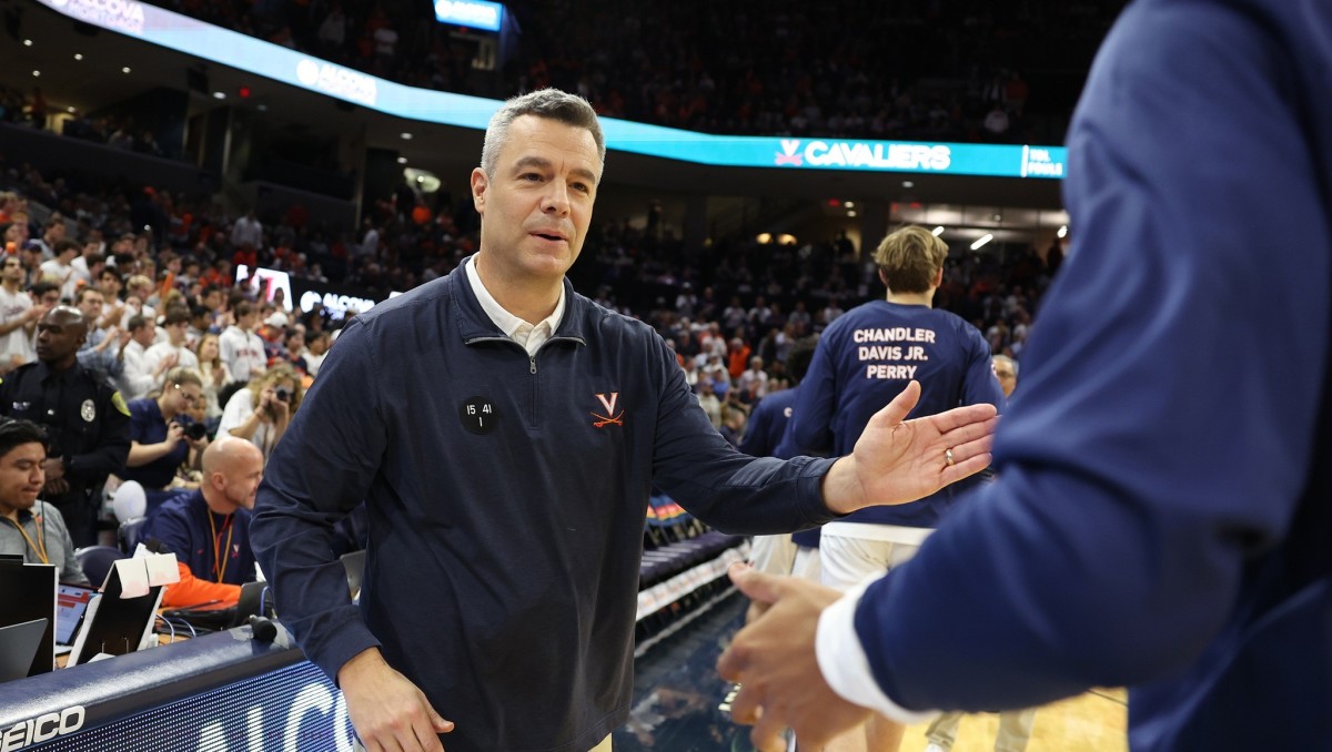 Tony Bennett greets his players before the Virginia men's basketball game against Houston at John Paul Jones Arena.